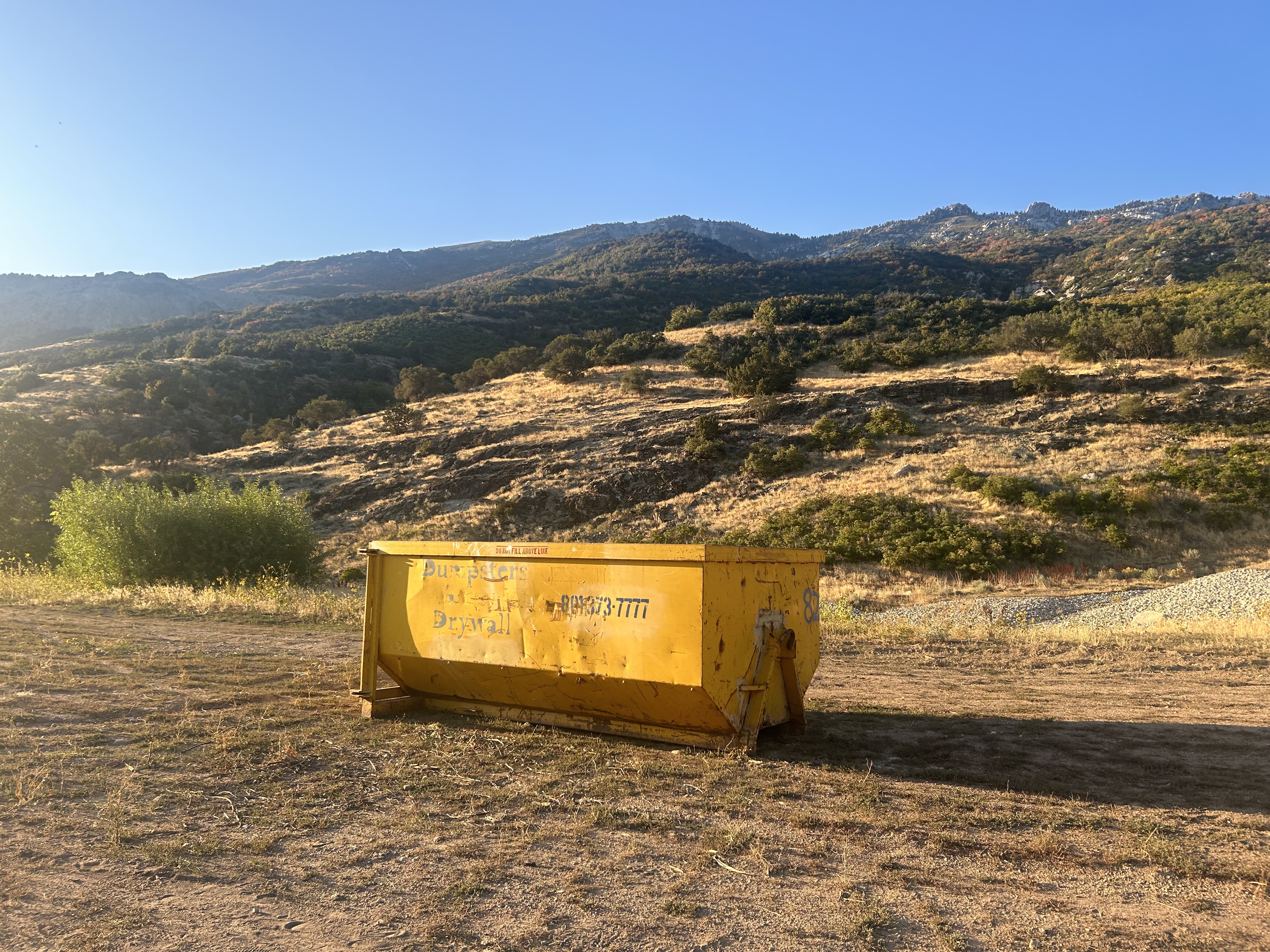 a dumpster in a mountain landscape