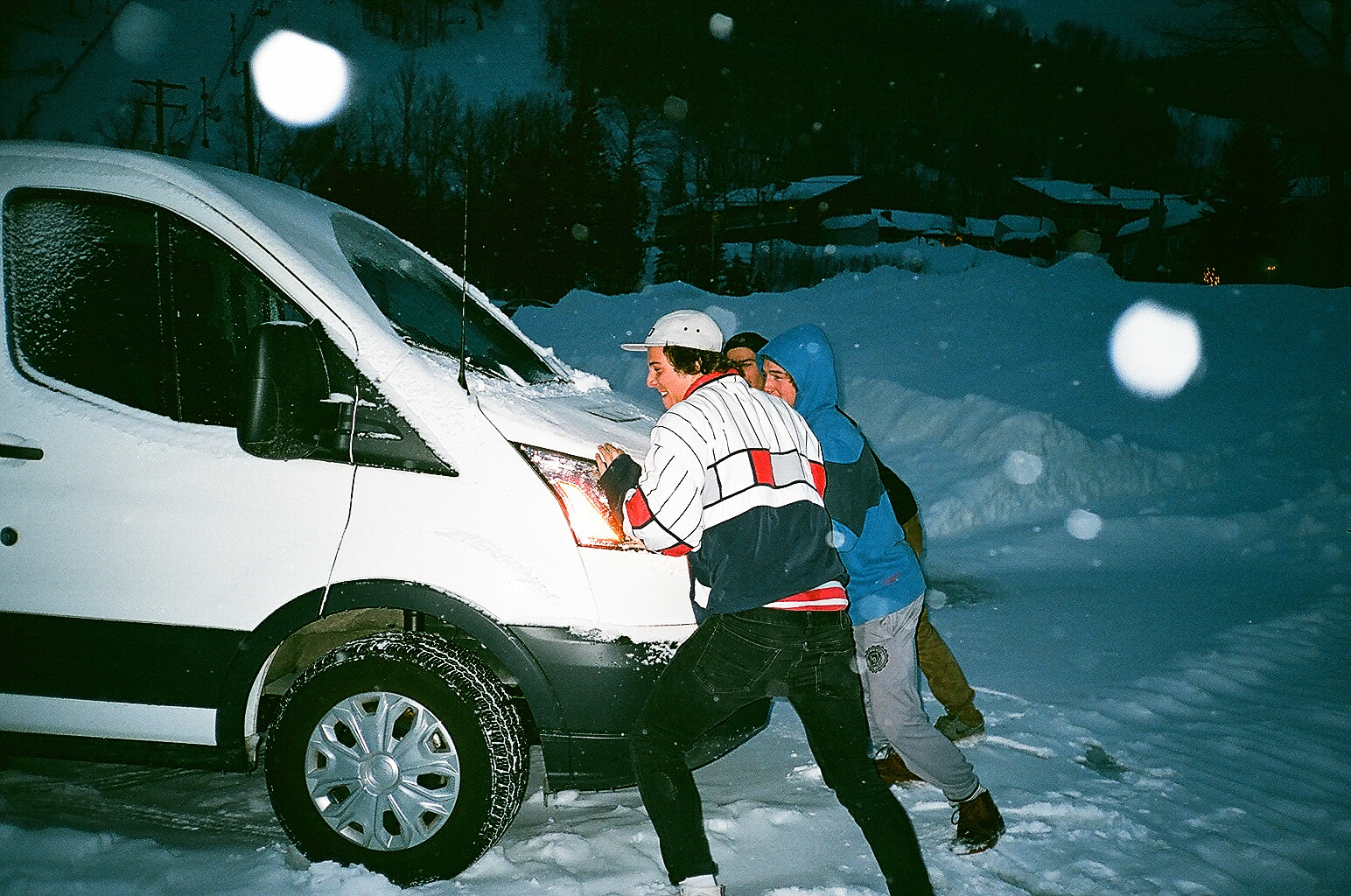 a photo of a people pushing a car